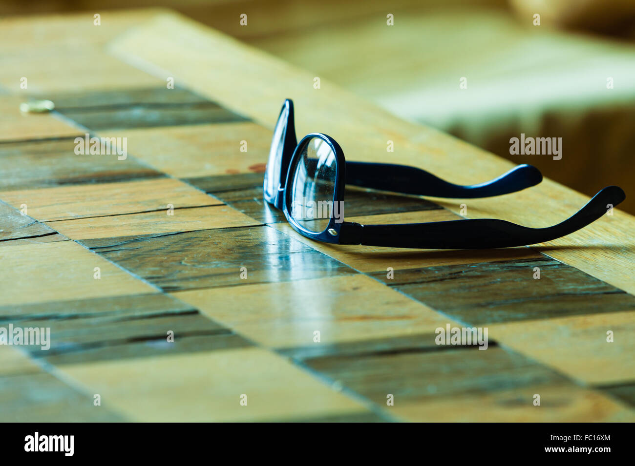 Pair of glasses on a checkered table Stock Photo Alamy