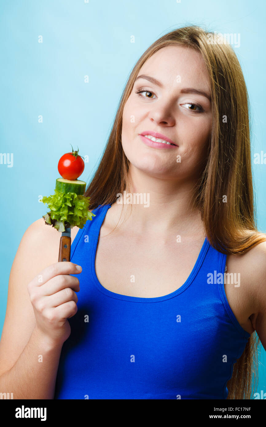 Attractive woman holding healthy food Stock Photo - Alamy