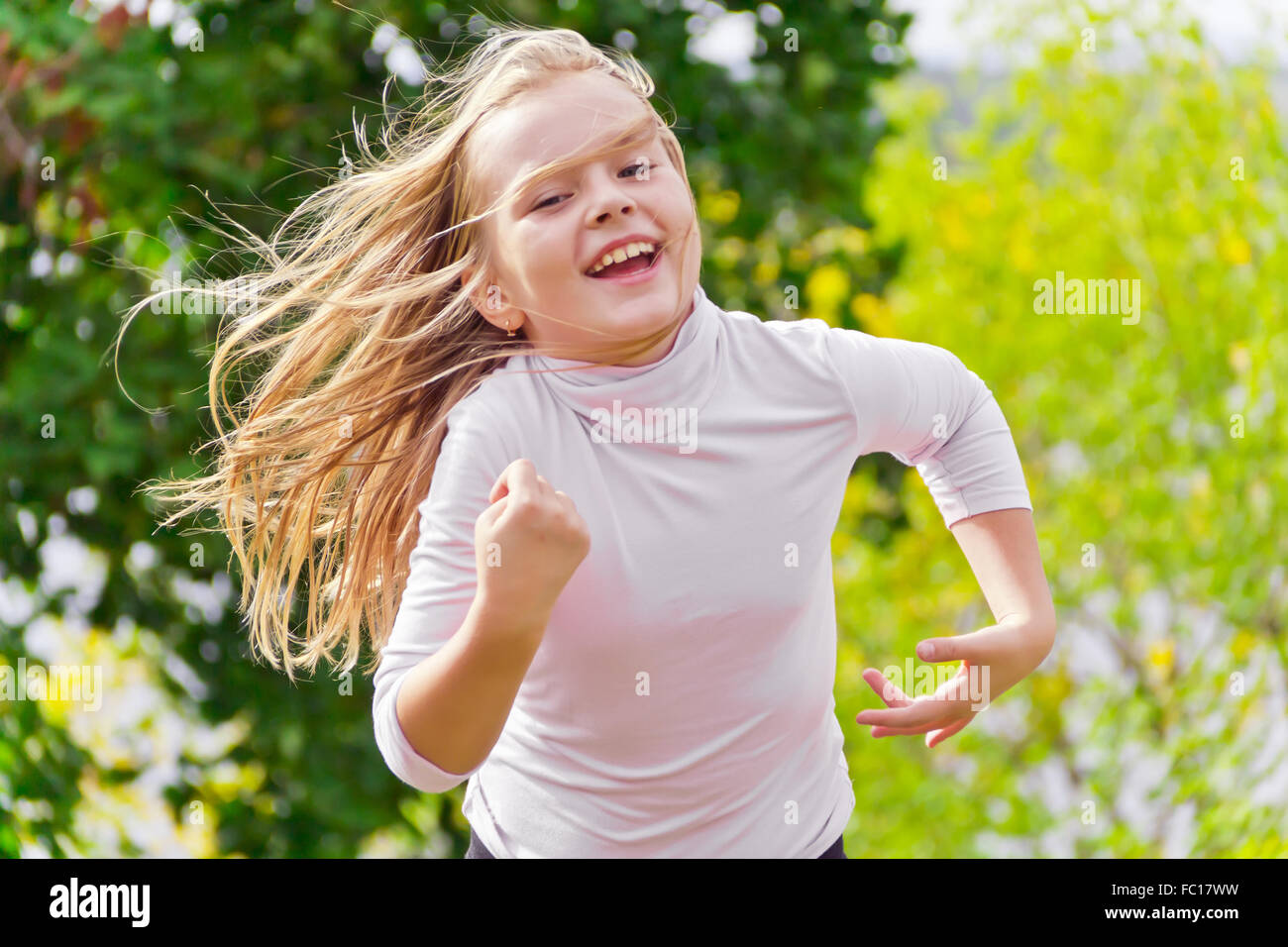 Cute running girl Stock Photo