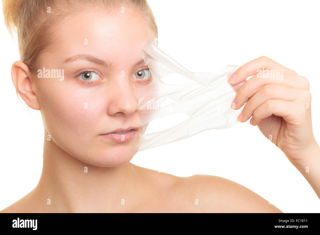 girl removing facial peel off mask Stock Photo Alamy