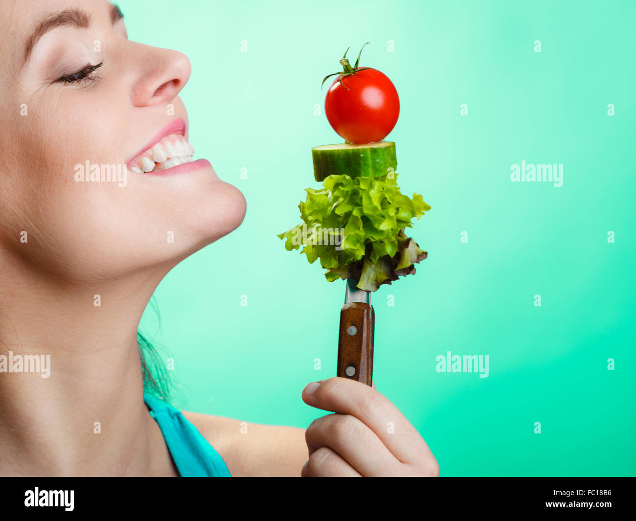 Portrait of smiling woman holding healthy food Stock Photo - Alamy