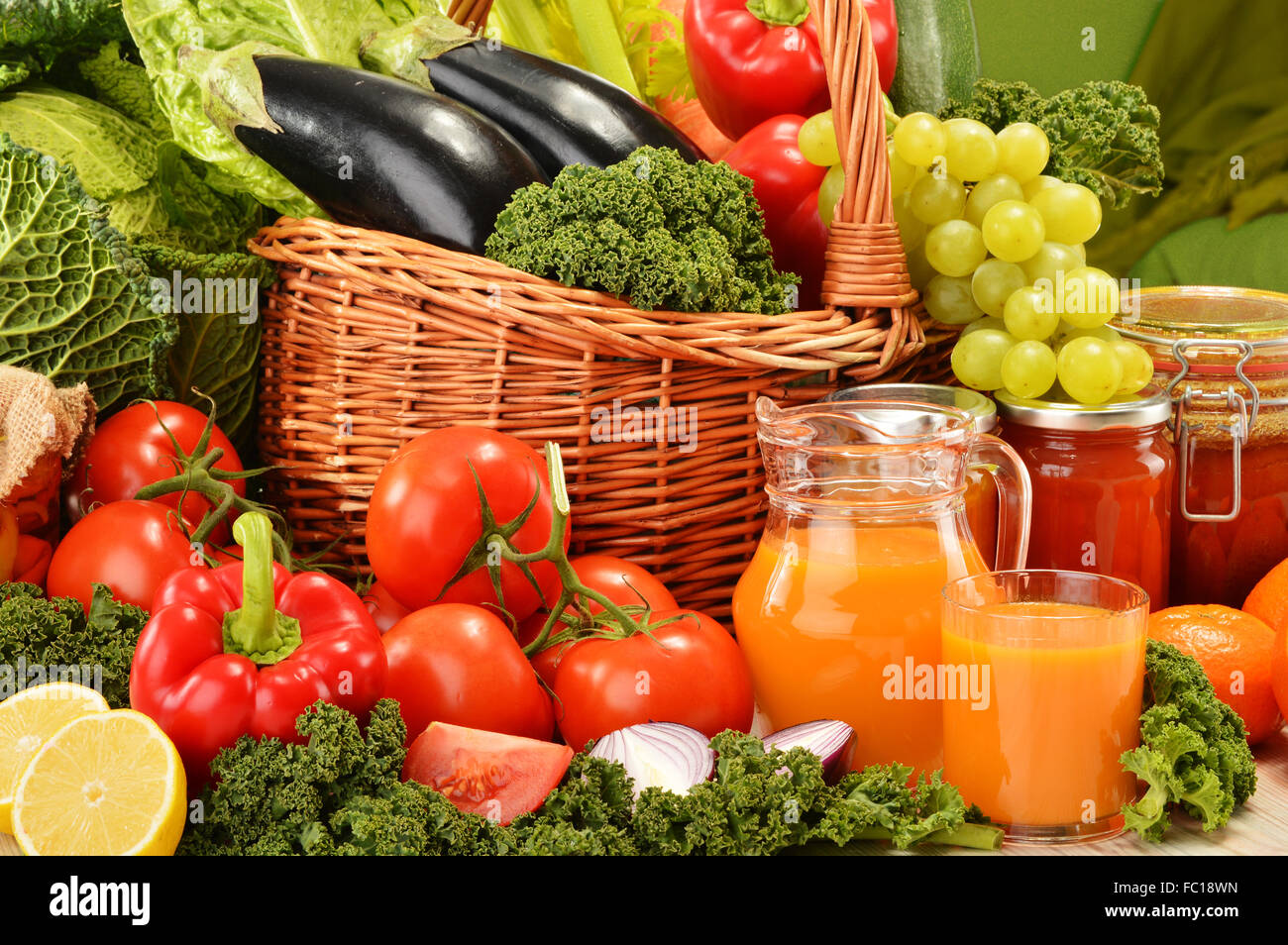 Wicker basket with assorted organic vegetables and fruits Stock Photo ...