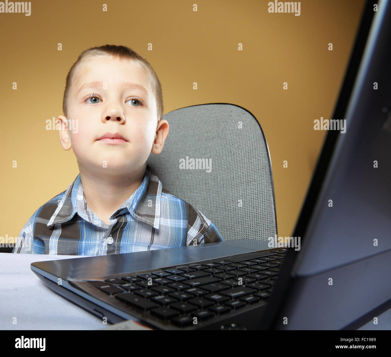 Computer addiction child with laptop notebook Stock Photo Alamy