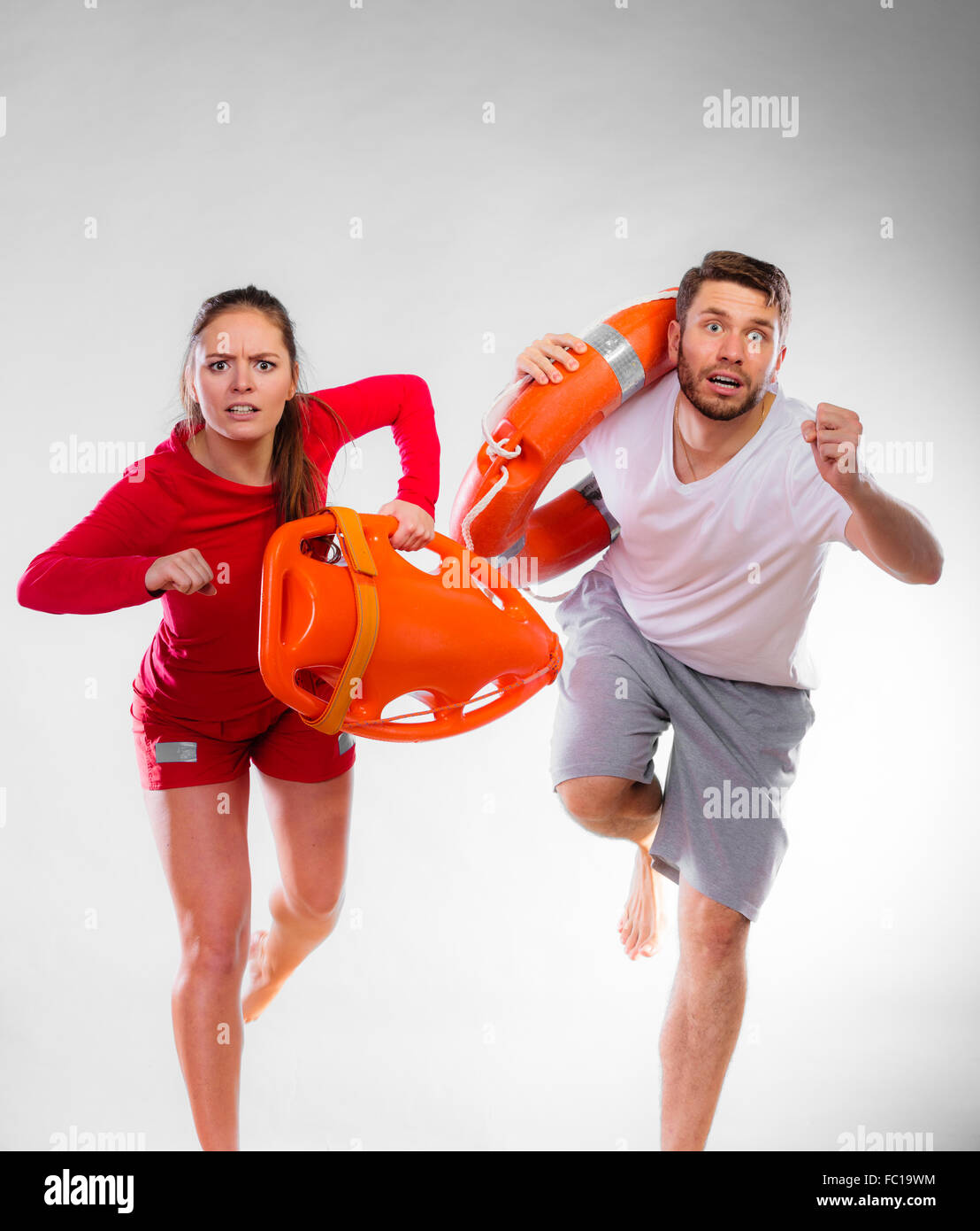 lifeguards running with equipment Stock Photo Alamy