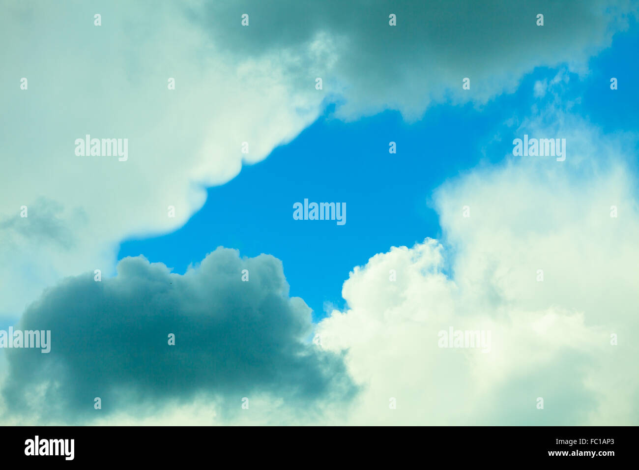 Deep blue sky background with white clouds Stock Photo Alamy