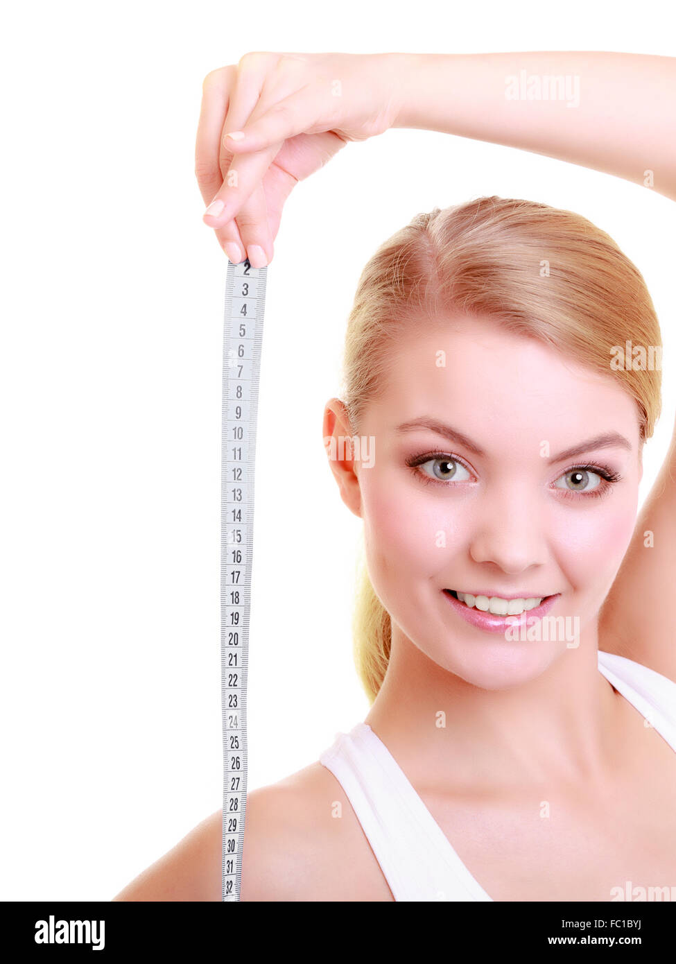 Diet. Fitness woman fit girl with measure tape isolated Stock Photo Alamy