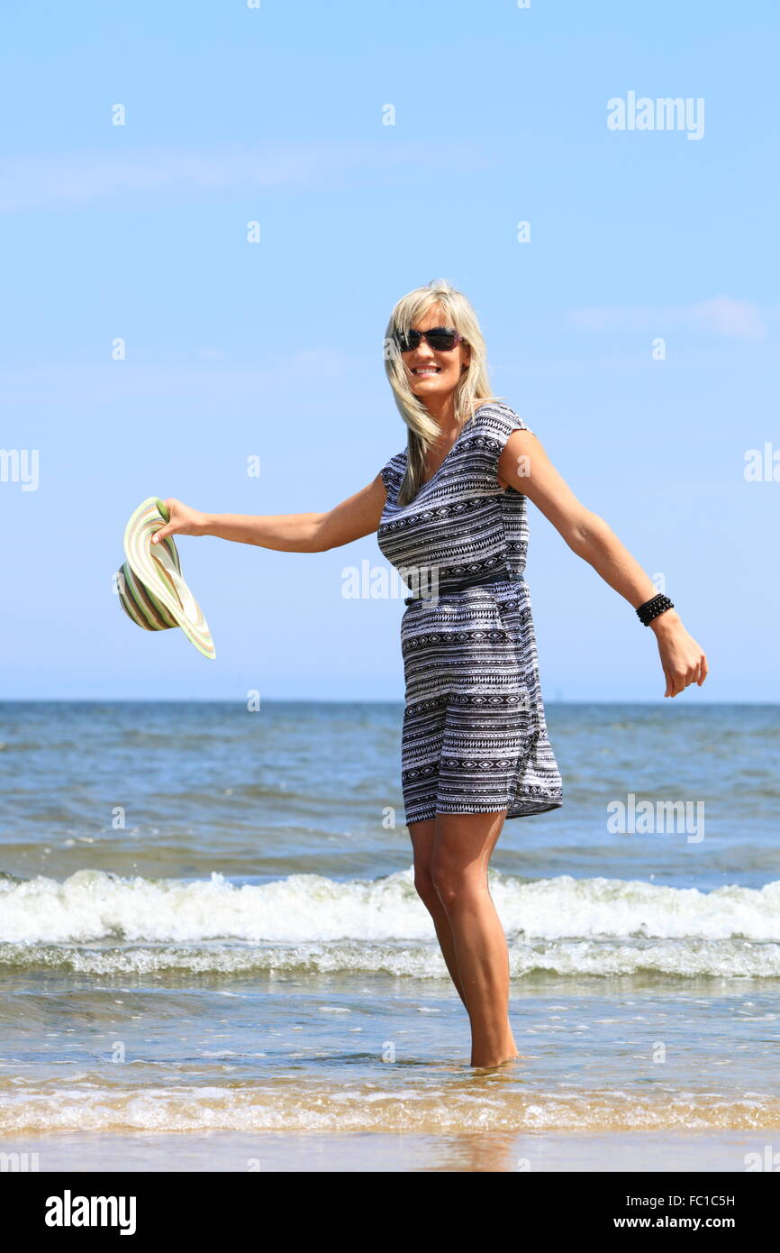 Mature woman beach holiday hi-res stock photography and images - Alamy