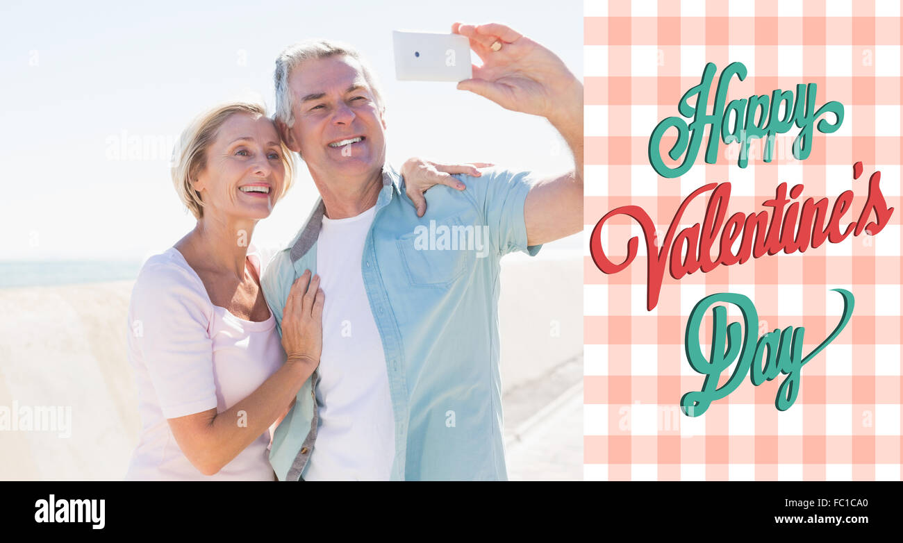 Composite image of happy senior couple posing for a selfie Stock Photo ...
