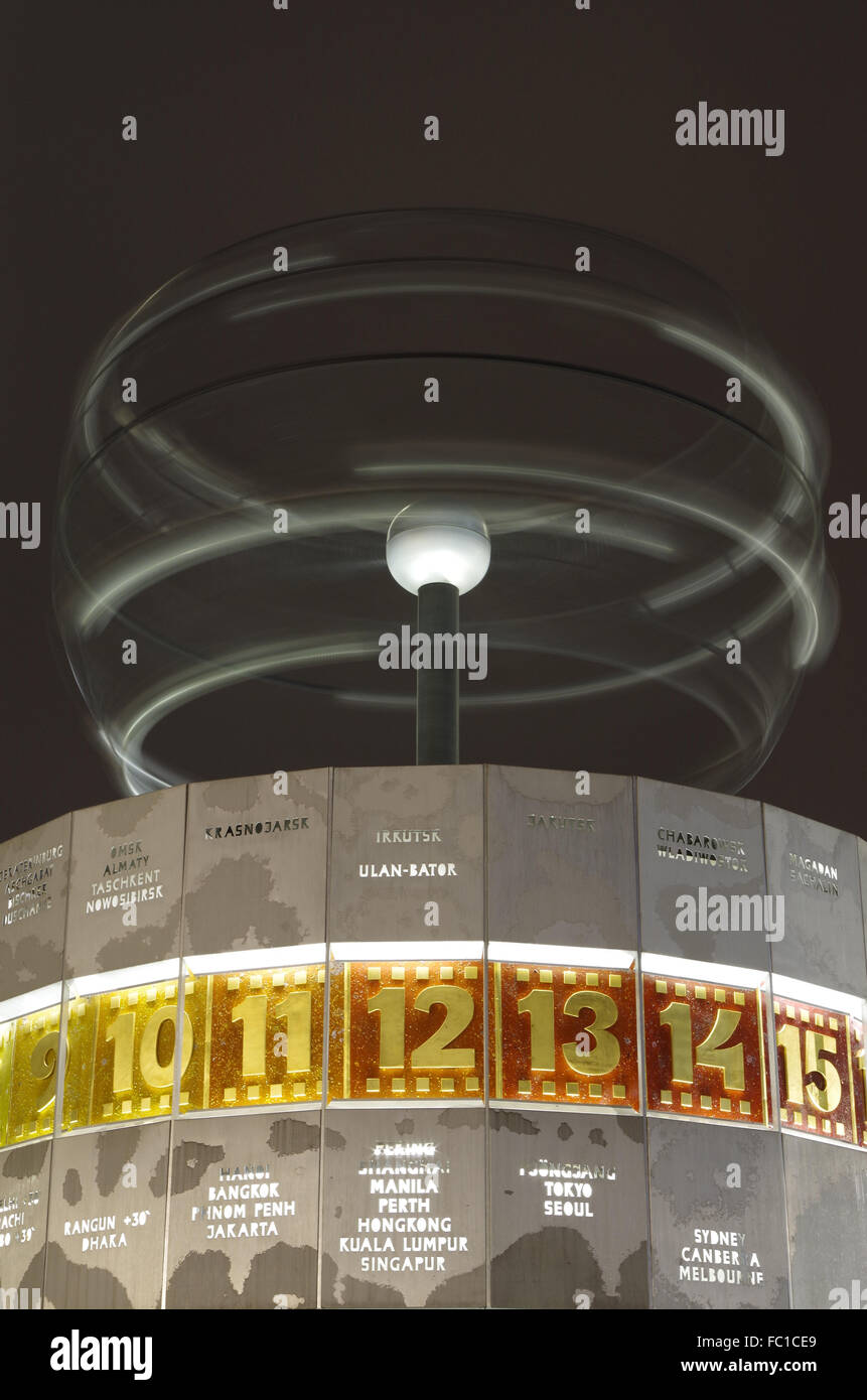 world time clock in berlin at night Stock Photo Alamy