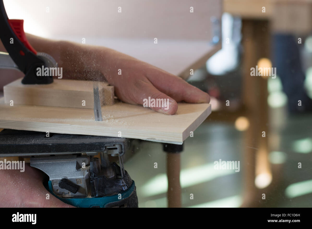 Carpenter working with Jigsaw Stock Photo