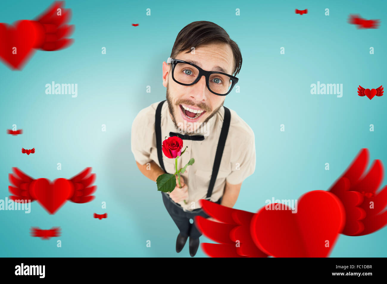 Composite image of geeky lovesick hipster holding rose Stock Photo - Alamy