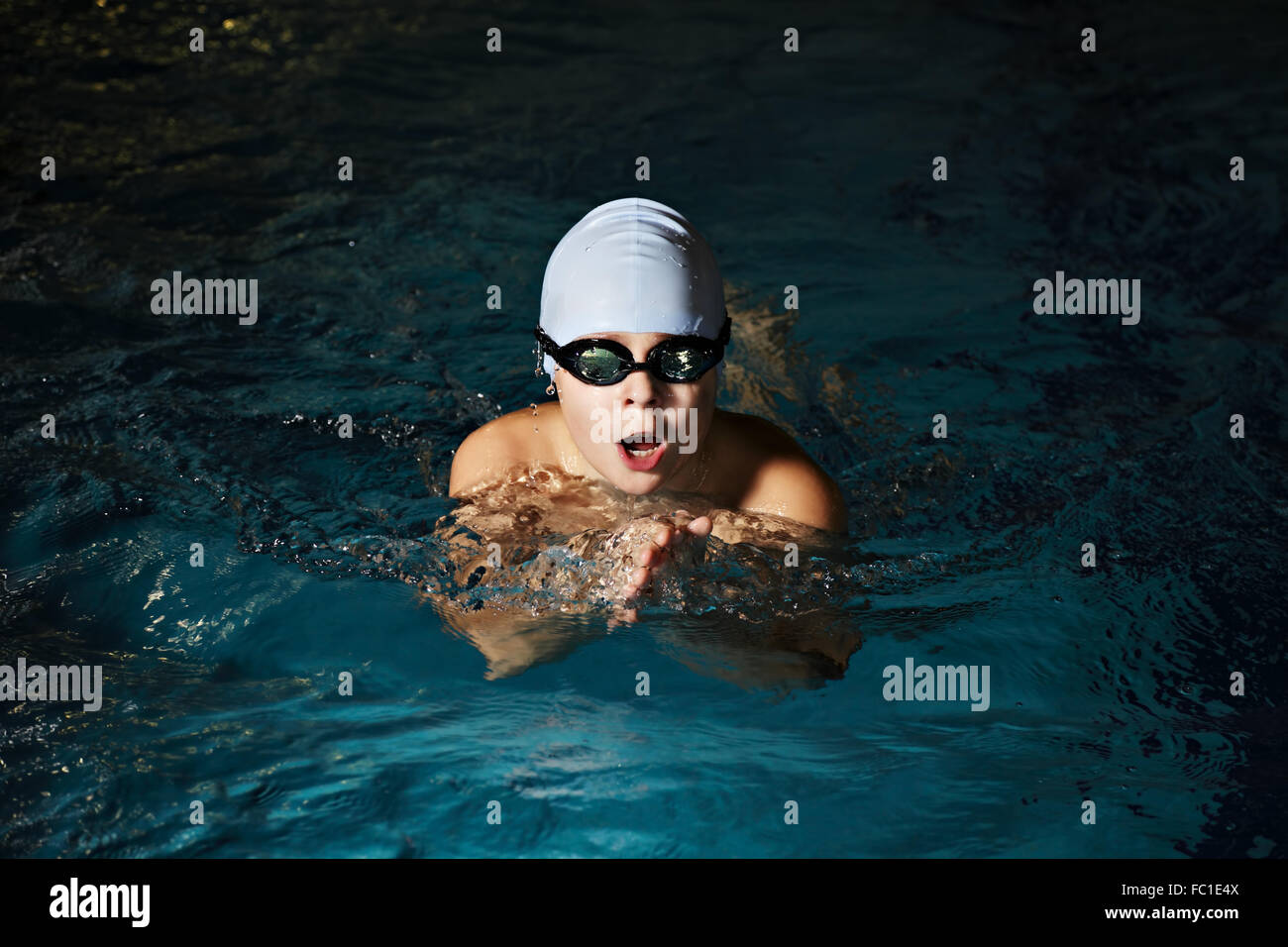 Kid swimming breaststroke closeup Stock Photo