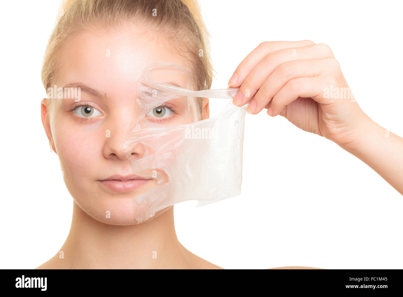 girl removing facial peel off mask Stock Photo Alamy
