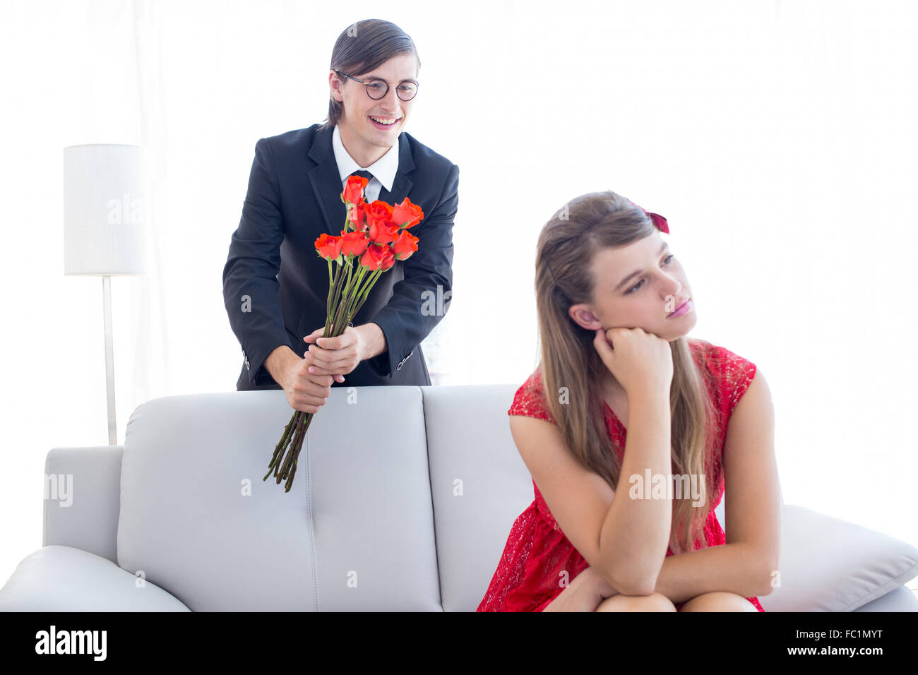 Geeky couple having an argue in the livingroom Stock Photo - Alamy