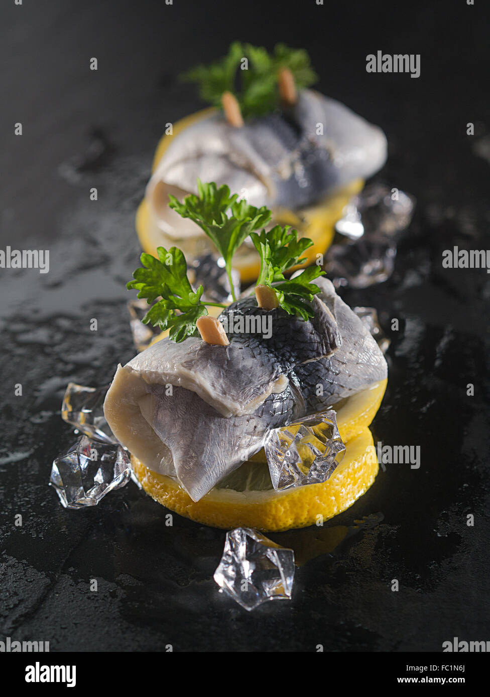 Rollmop herring on lemon slices Stock Photo