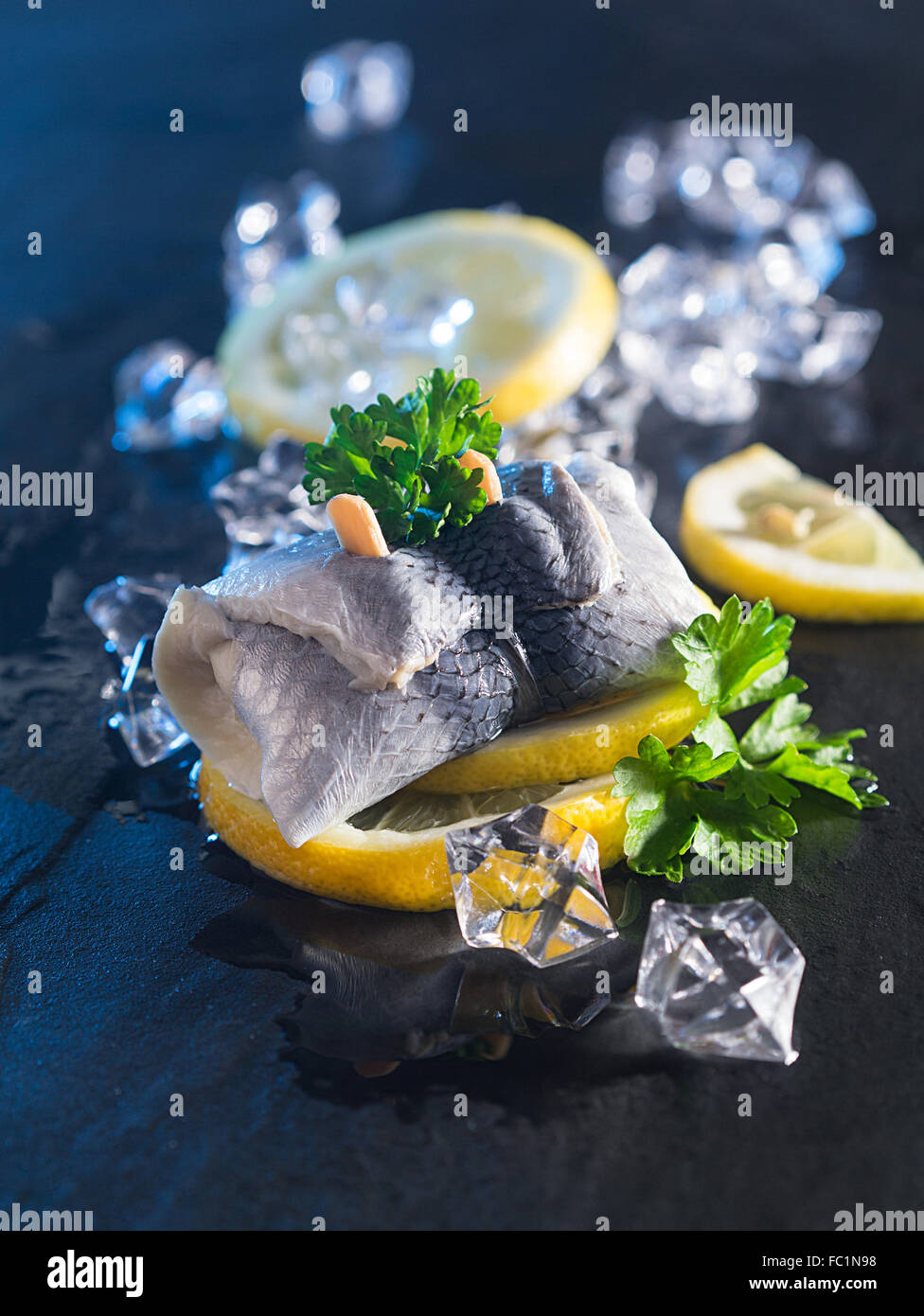 Rollmop herring on lemon slices Stock Photo