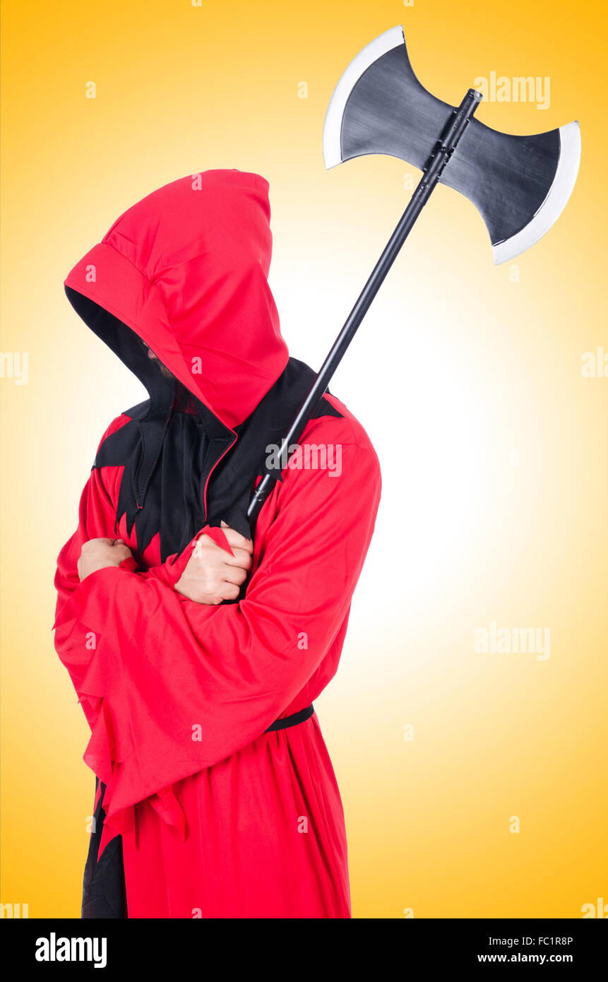 Executioner in red costume with axe on white Stock Photo