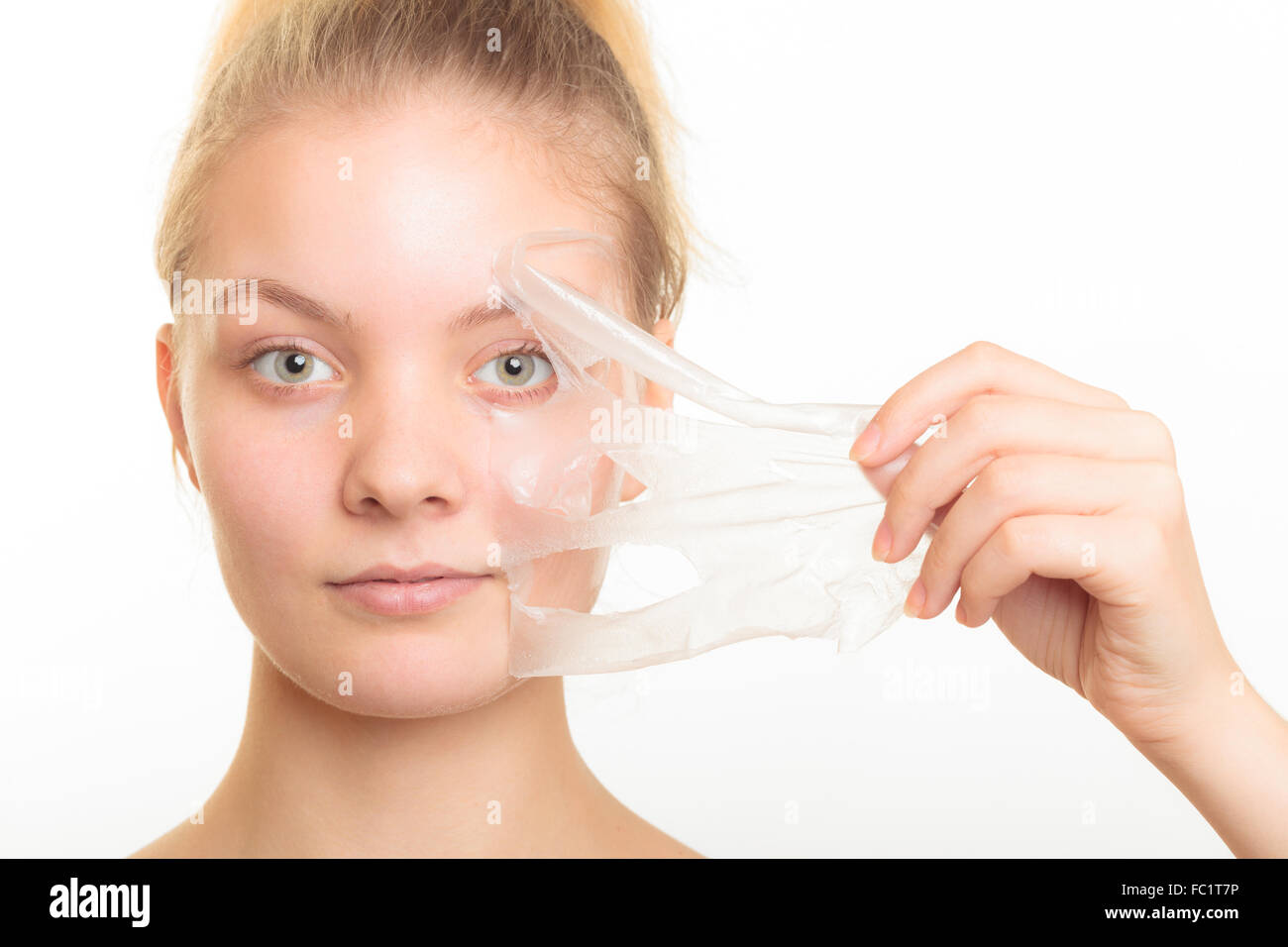 girl removing facial peel off mask Stock Photo Alamy