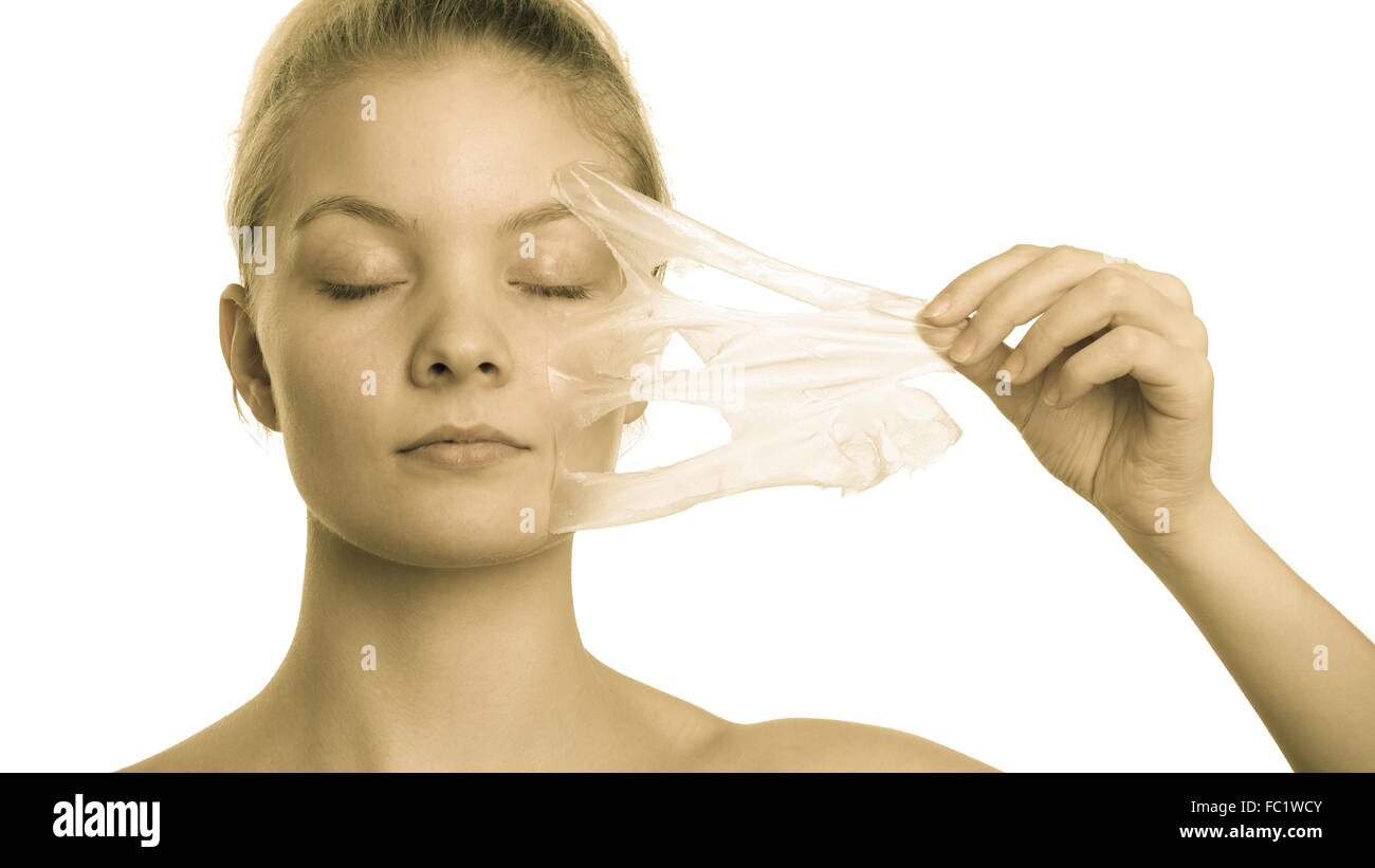 girl removing facial peel off mask Stock Photo Alamy