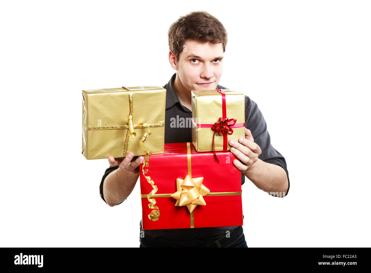 Holiday. Young man giving presents gifts boxes Stock Photo