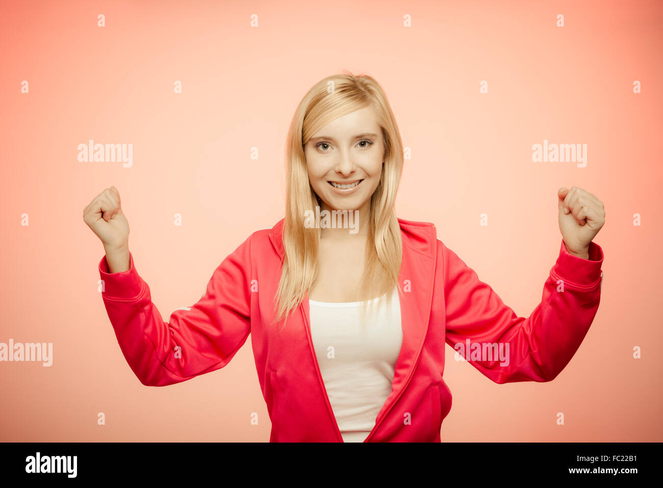 Fitness woman showing fresh energy flexing biceps muscles Stock Photo