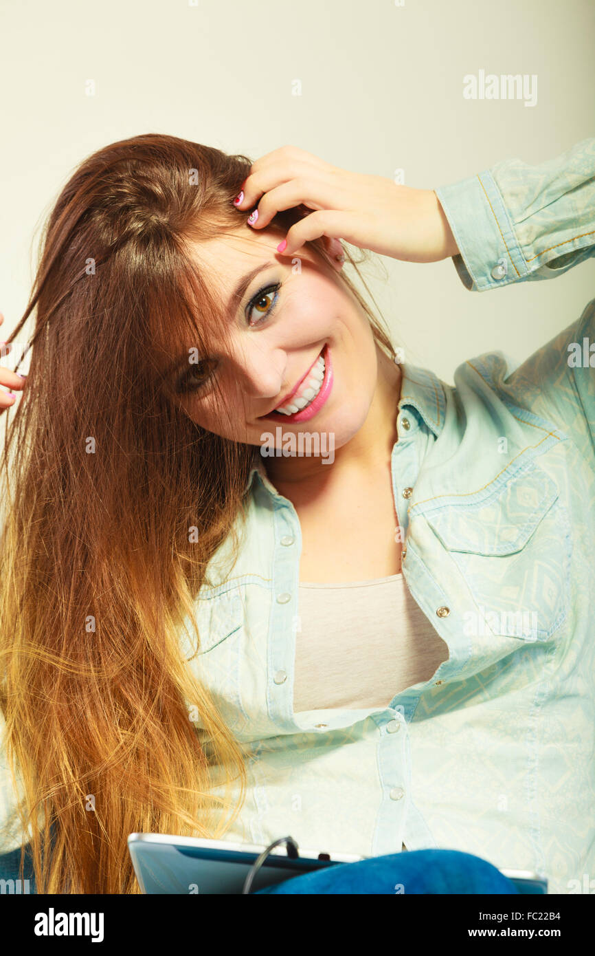 Woman with tablet headphones relaxing Stock Photo