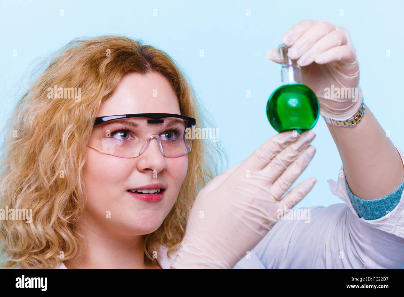 female chemistry student with glassware test flask. Stock Photo