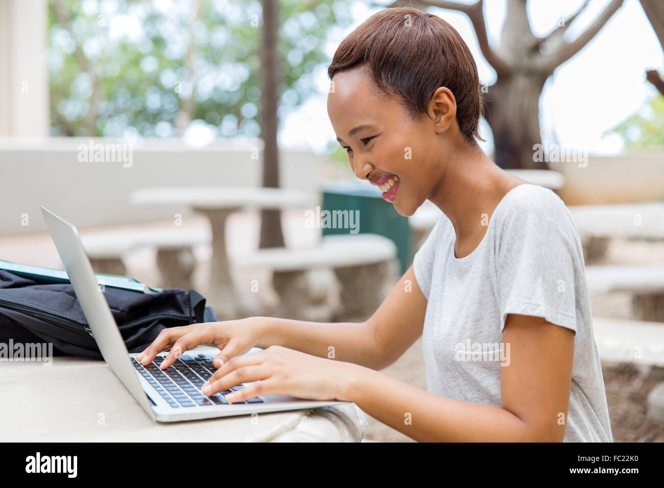 smart female African college student working on laptop Stock Photo - Alamy