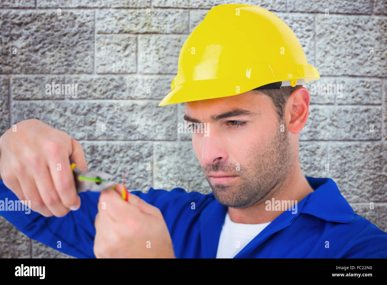 Composite image of electrician wearing hard hat while cutting wire