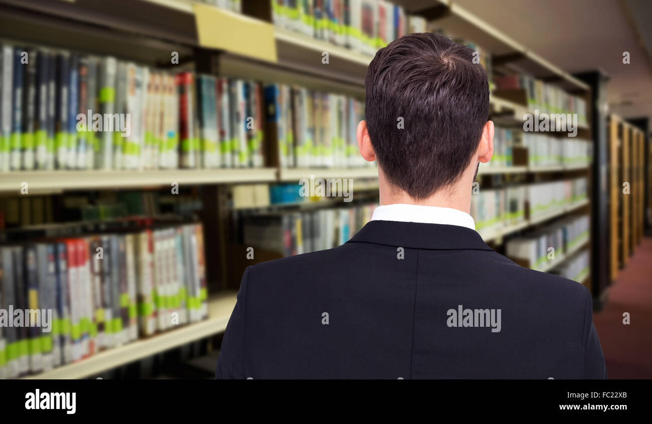 Composite image of rear view of businessman in suit standing Stock ...