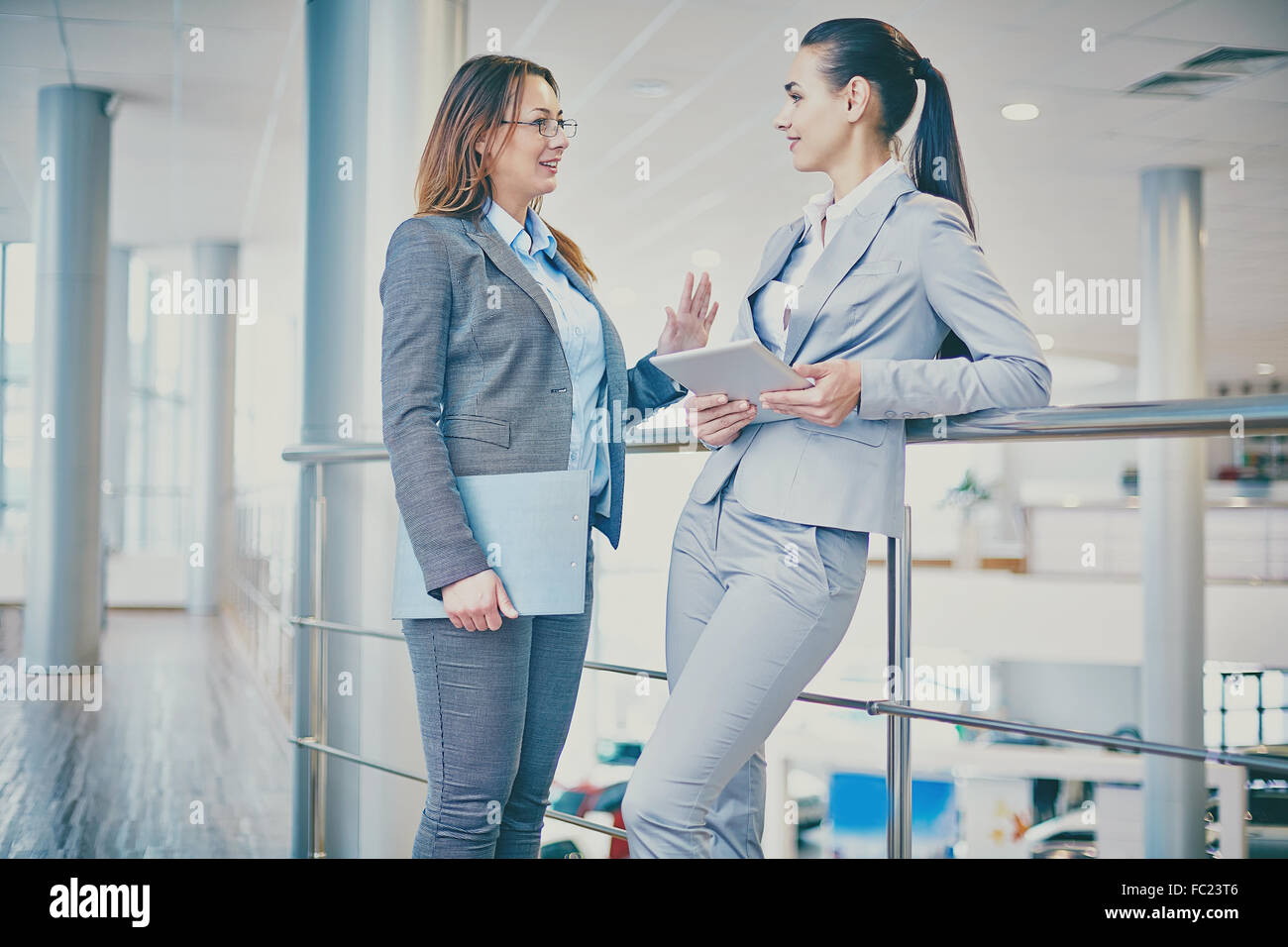 Two businesswomen interacting at meeting Stock Photo