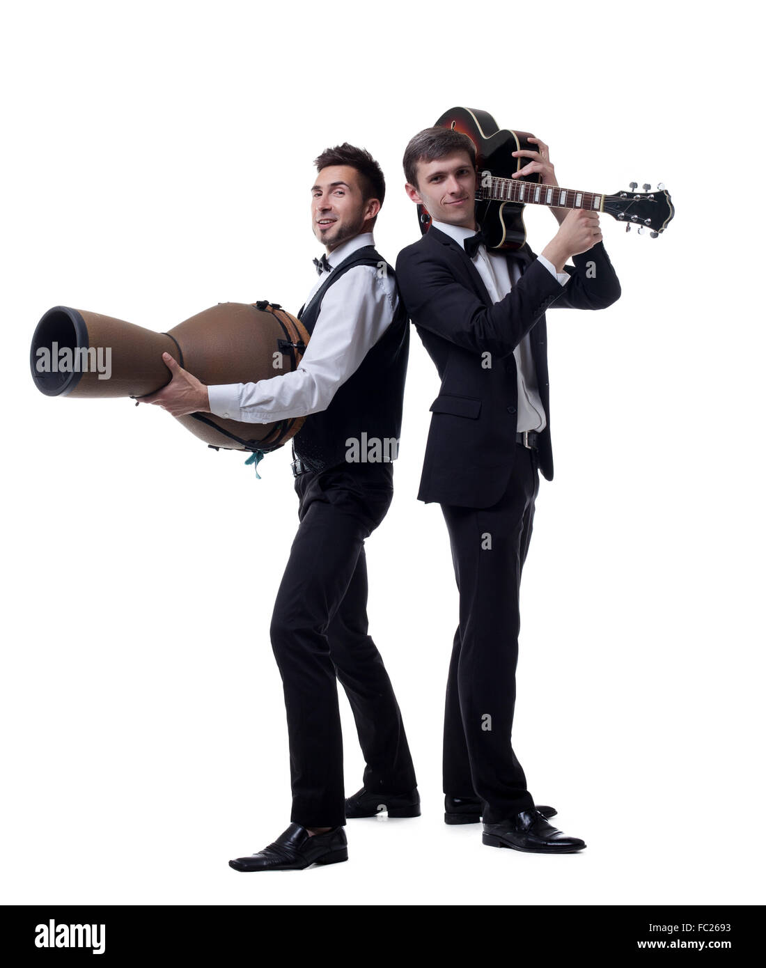 Funny guys posing with musical instruments Stock Photo