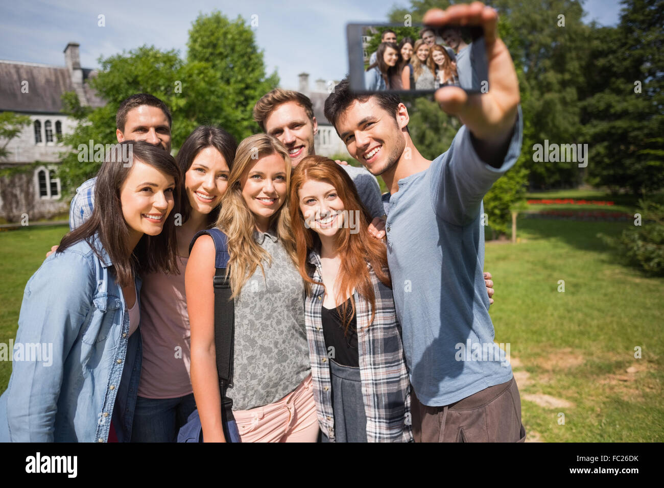 Happy students taking a selfie outside on campus Stock Photo - Alamy