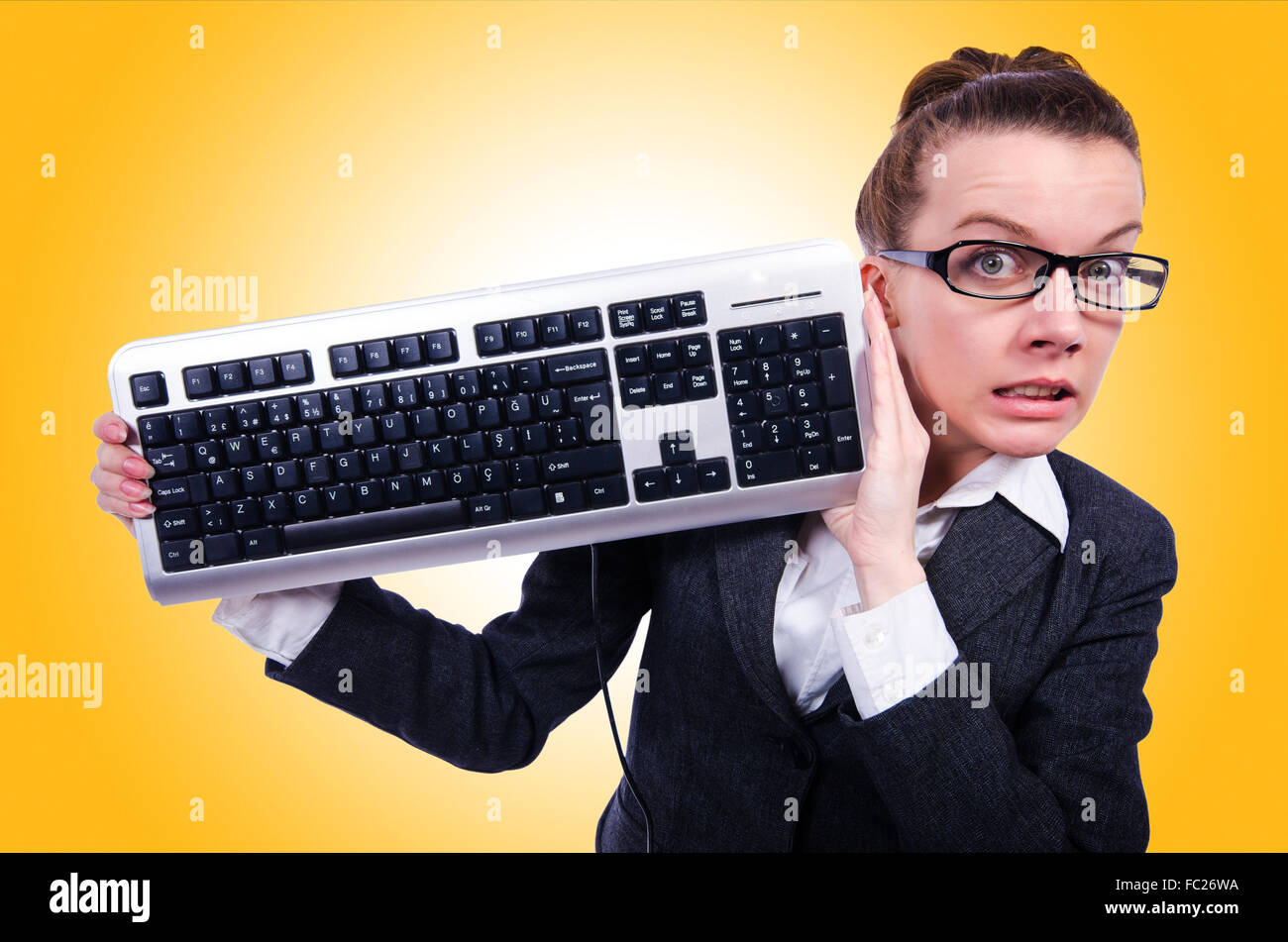 Nerd Using Keybords Nerd businessman with computer keyboard on white Stock Photo - Alamy