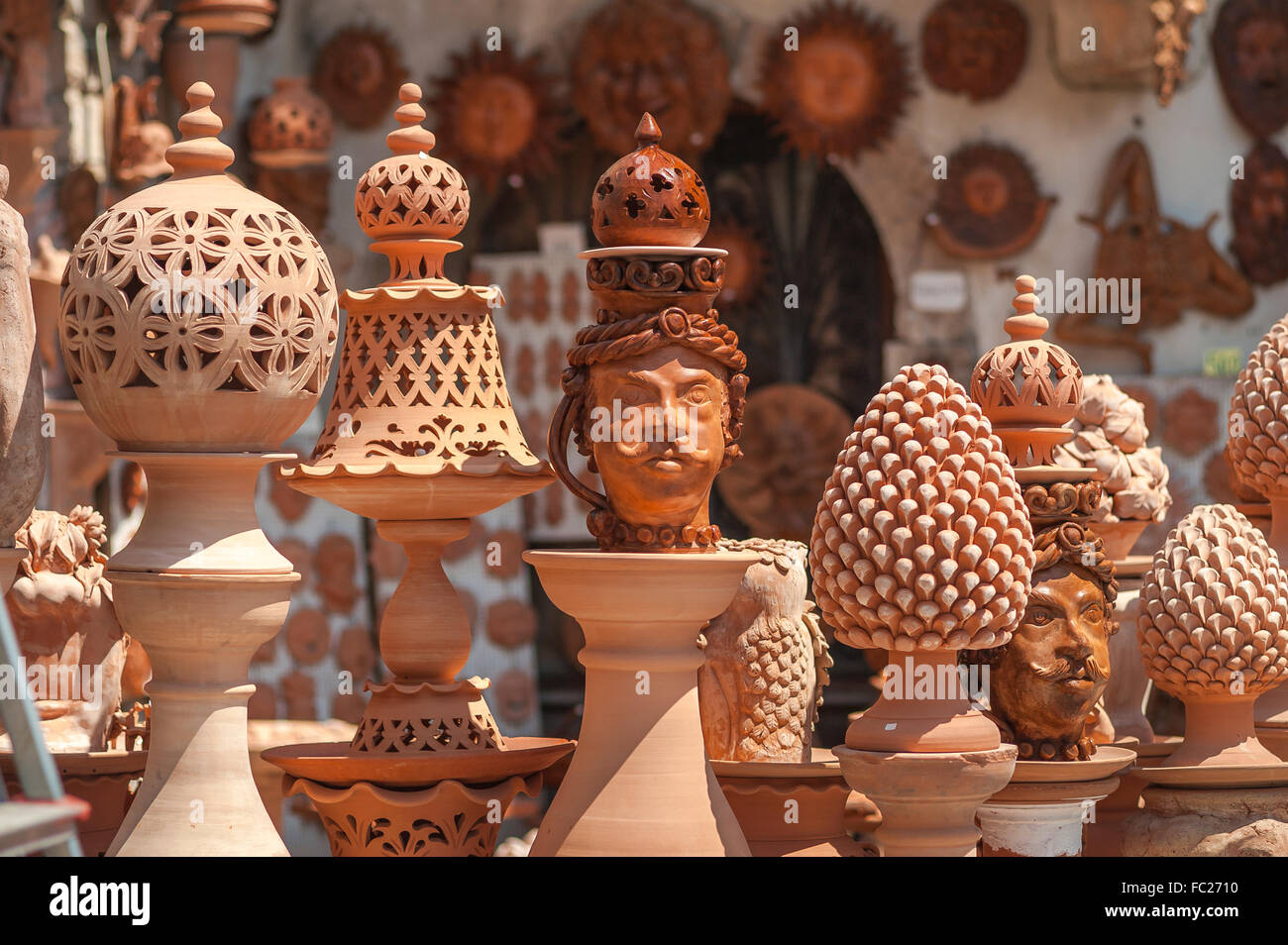 Terracotta pottery, view of Terracotta lanterns and busts for sale in a