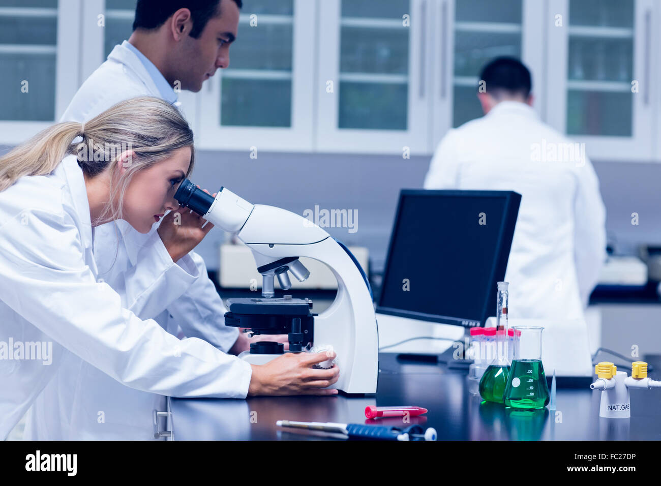 Science student working with microscope in the lab Stock Photo - Alamy