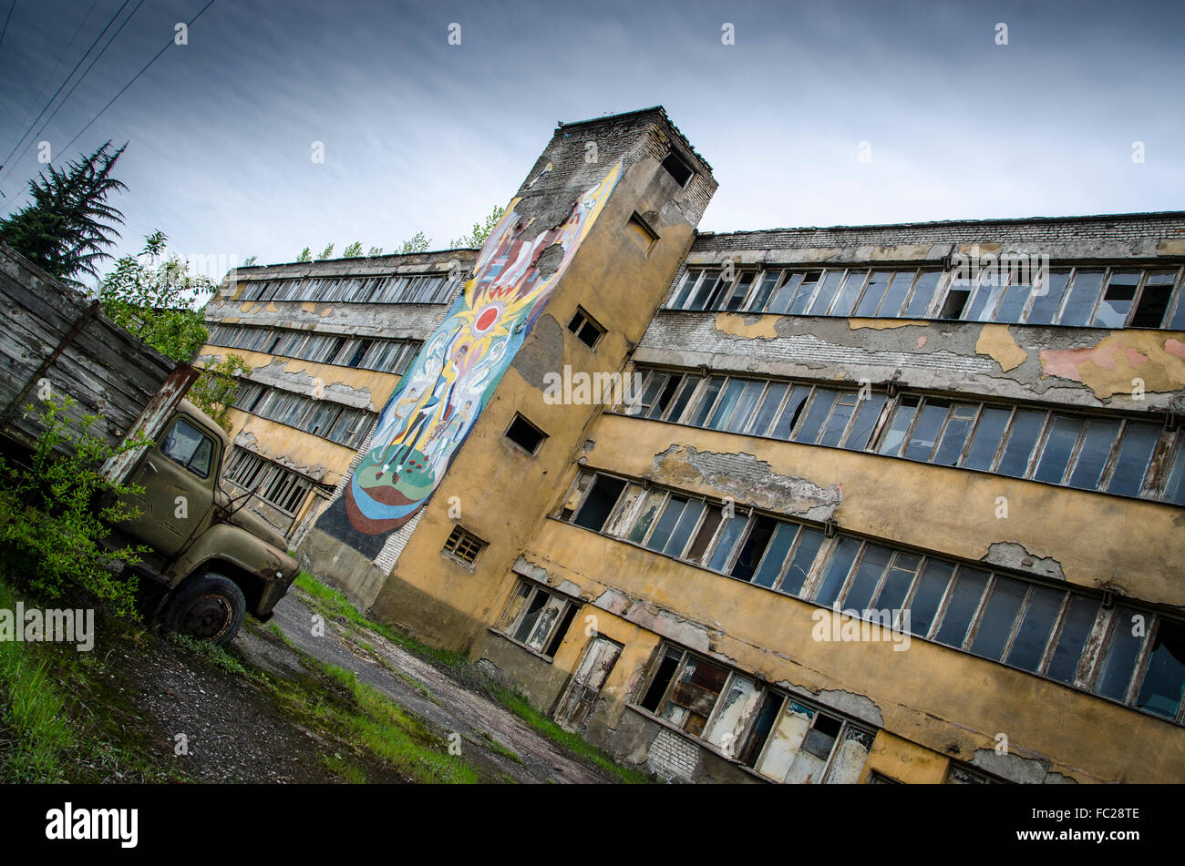 Abandoned factory. Georgia. Post Communist. Communist artwork. Stock Photo