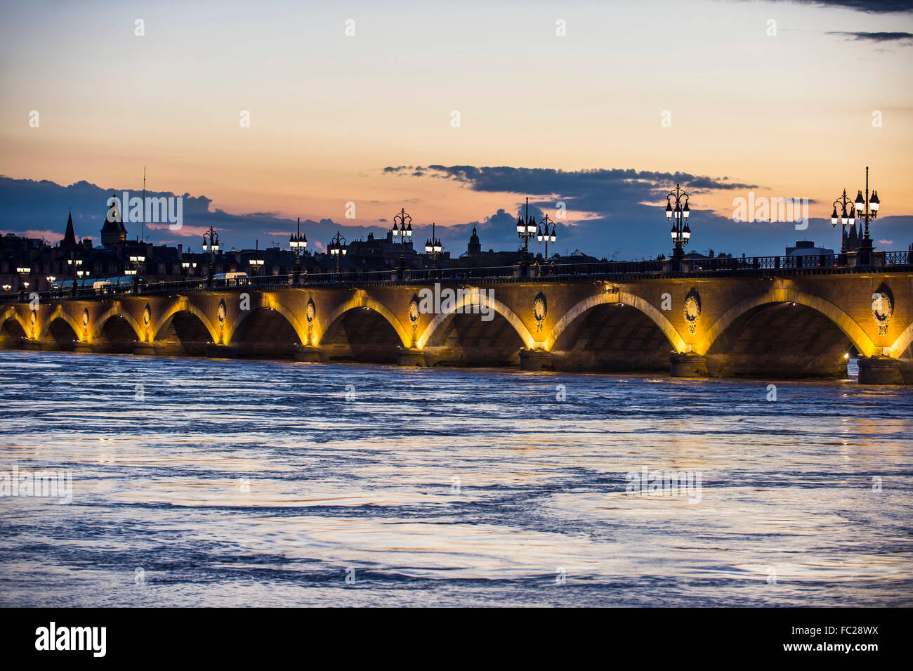 Pont de Pierre, historical bridge over the Garonne river at dusk, Bordeaux, France Stock Photo