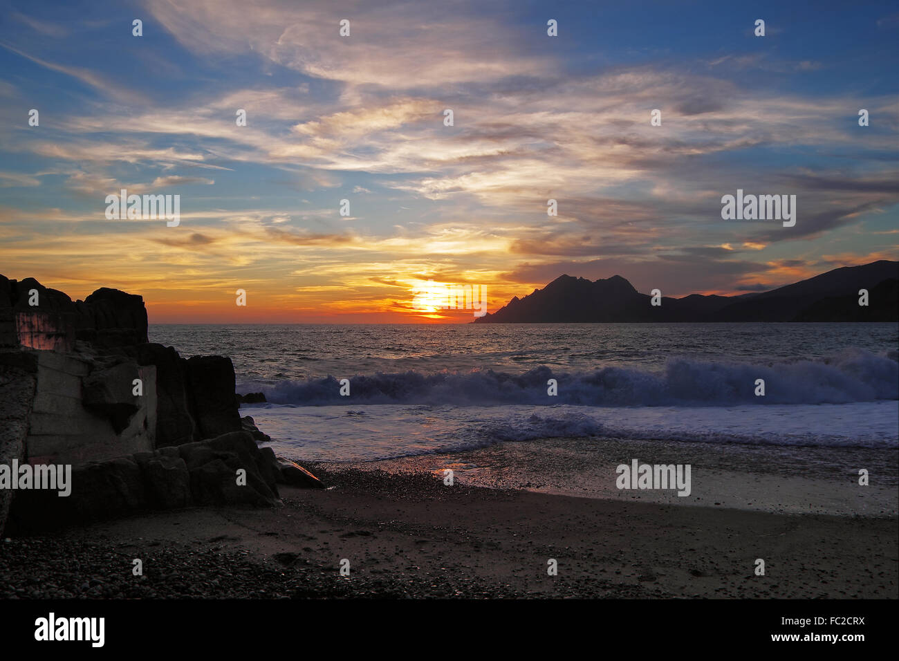 Sunset on the beach of Porto - Corsica Stock Photo