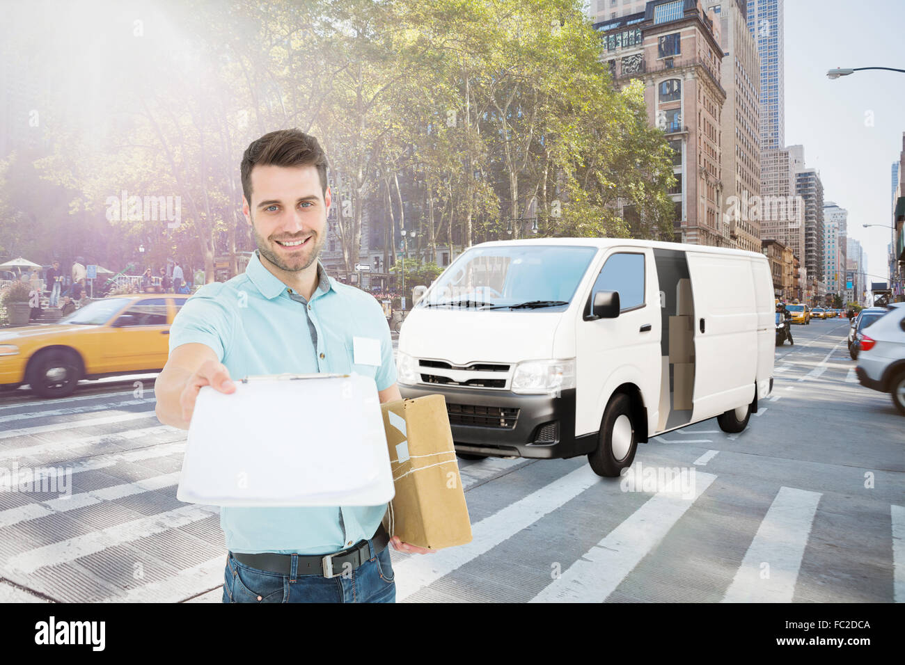 Composite image of delivery man with package giving clipboard for signature Stock Photo