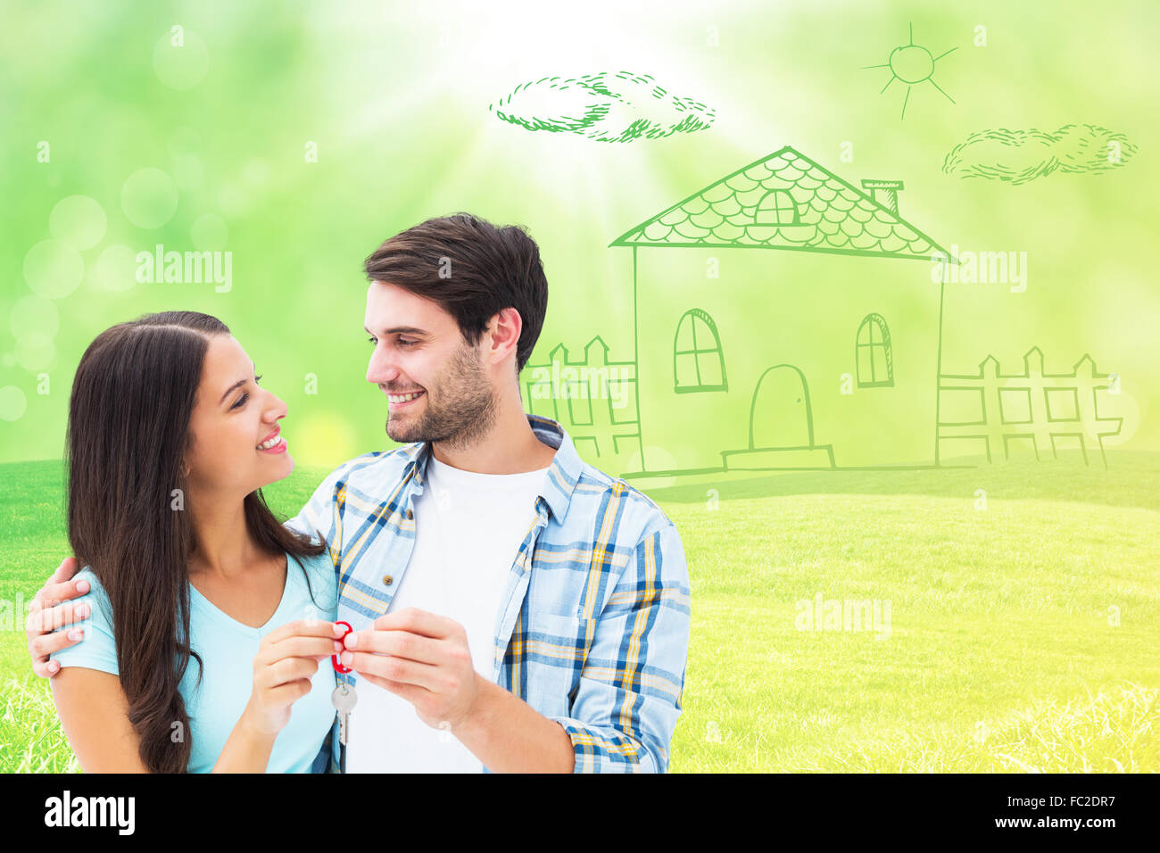 Composite image of happy young couple holding new house key Stock Photo ...