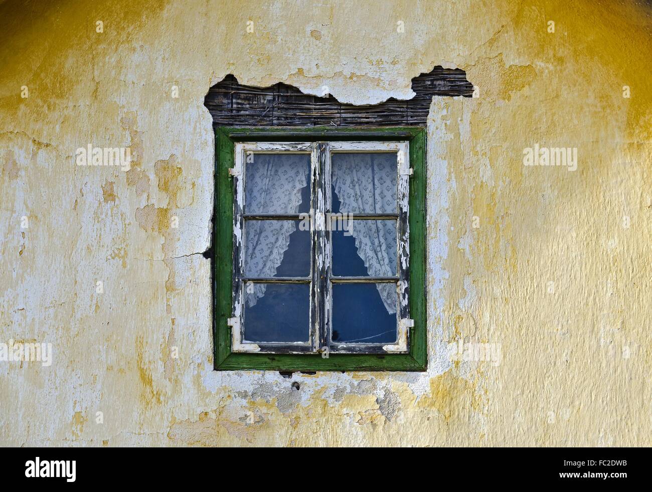 rotten window at a house front Stock Photo