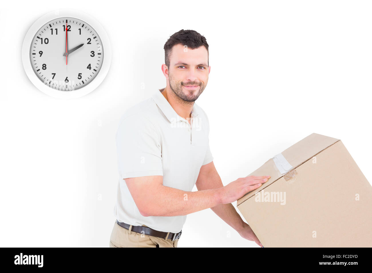 Composite image of delivery man pushing trolley of boxes Stock Photo