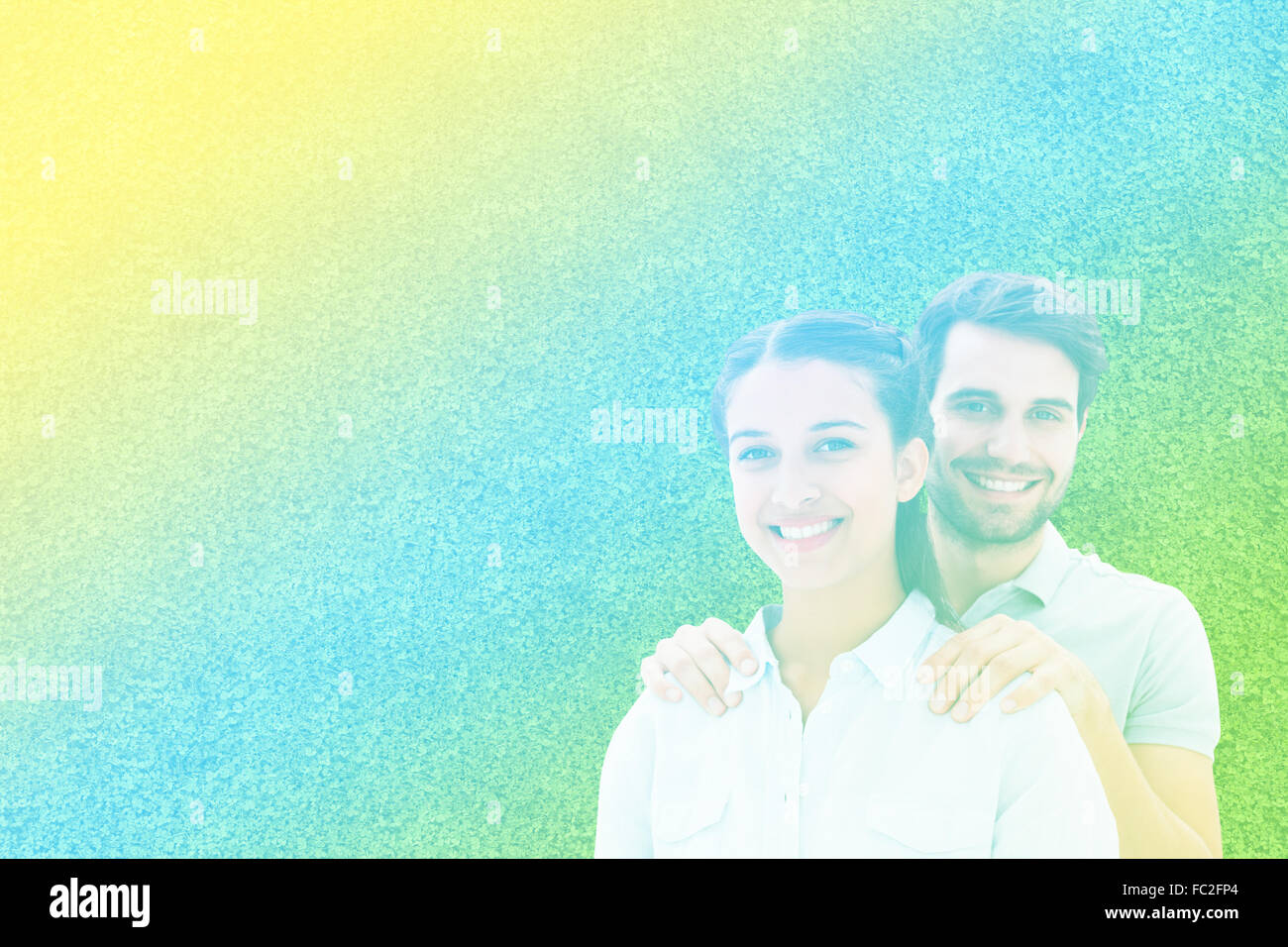 Composite image of cute couple smiling at camera Stock Photo - Alamy