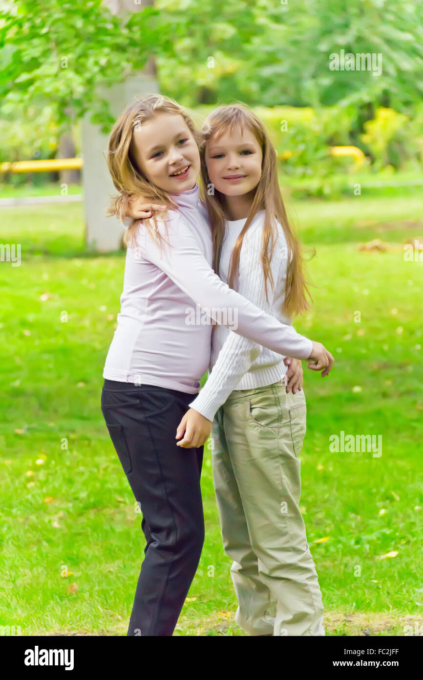 Cute Two Embracing Girls Stock Photo Image Of Seven   58958426