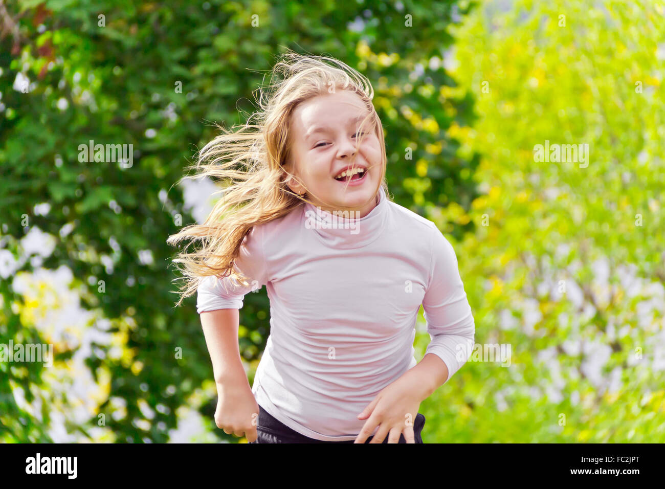 Cute running girl Stock Photo Alamy