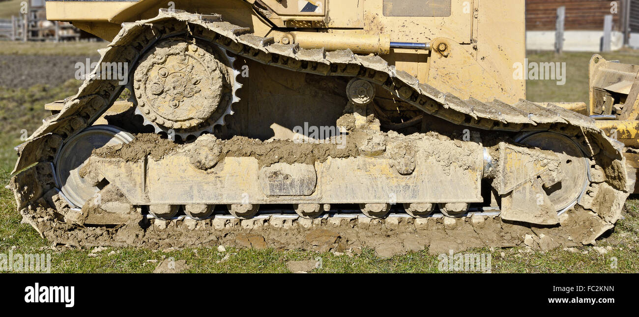 soiled chain drive of a construction vehicle Stock Photo