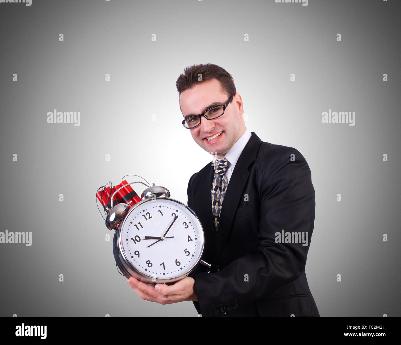 Man with time bomb isolated on white Stock Photo