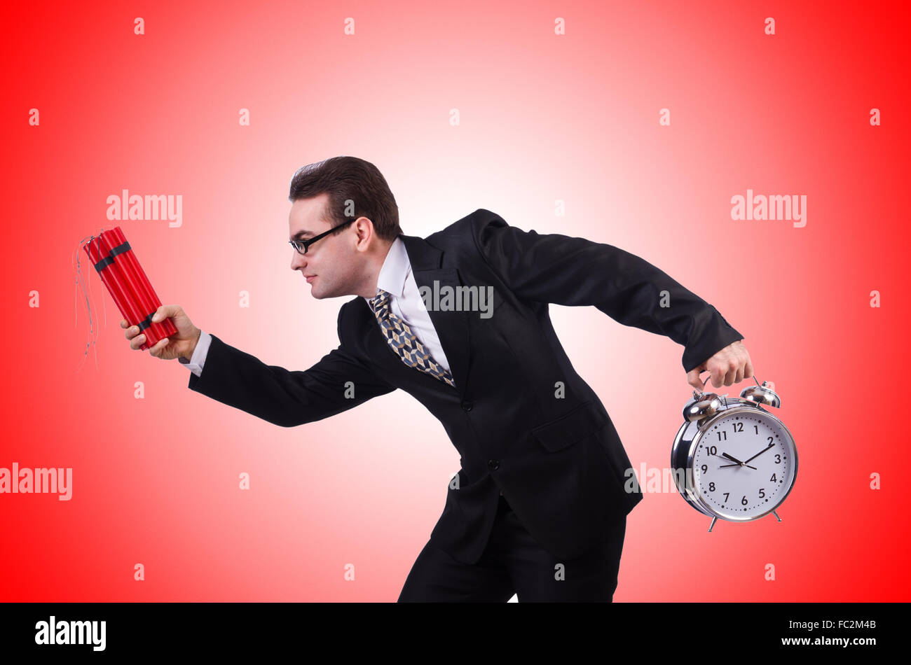 Man with time bomb isolated on white Stock Photo