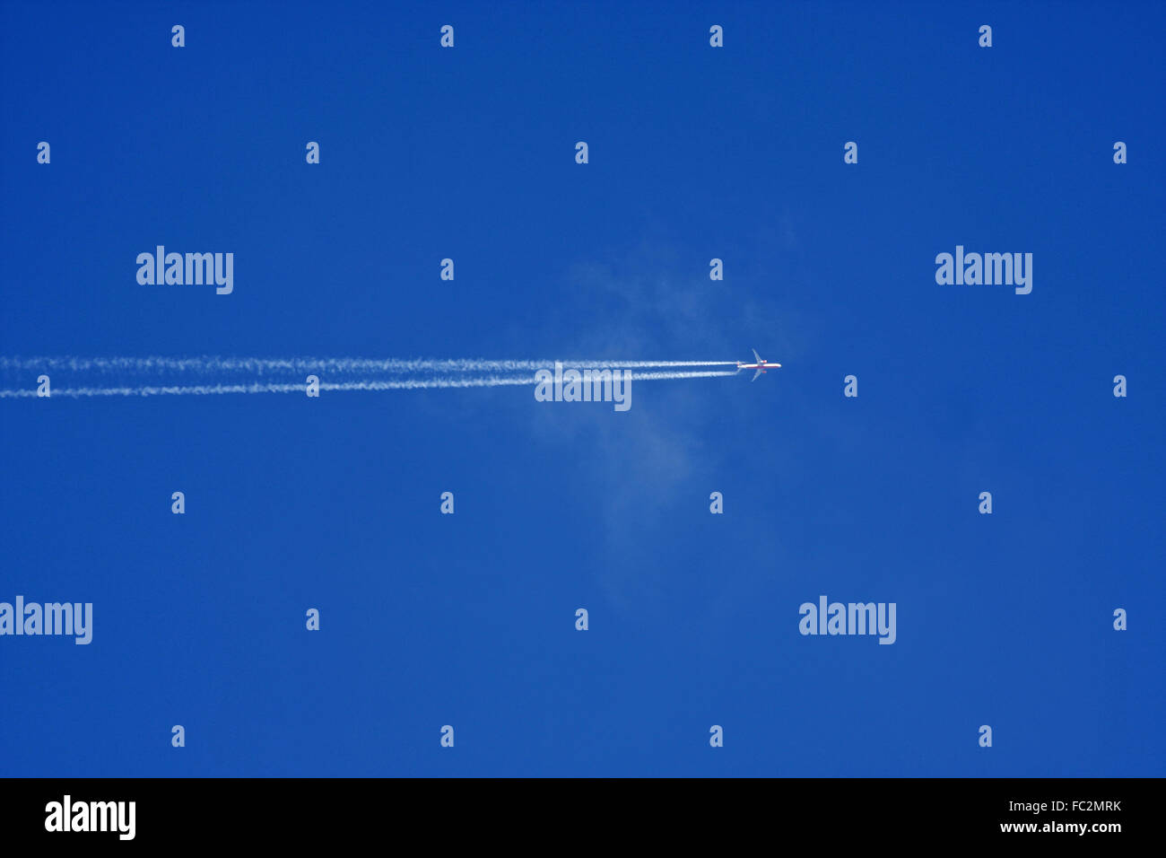 Passenger jet in flight Stock Photo - Alamy